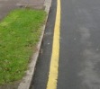 single yellow line road sign