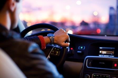 man driving car at night